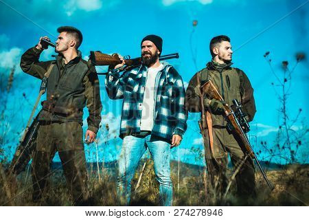 Hunter With Shotgun Gun On Hunt. Hunting In Russia
