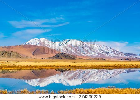 Beautiful Landscape Of Ulgii In Western Mongolia With The River, The Large Yellow Steppe And The Bea