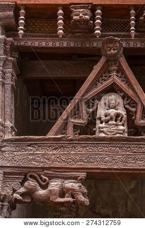 Ancient wooden carving on the entrance to Alchi monastery in Ladakh, India. Alchi monastery is a famous Buddhist temple near Leh, Ladakh, Jammu and Kashmir, India.