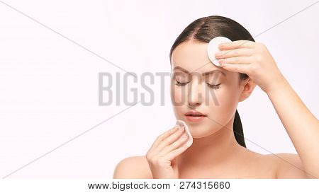 Home Face Care. Girl Remove Makeup. Woman Hand With Pad. Skin Clean With Cotton