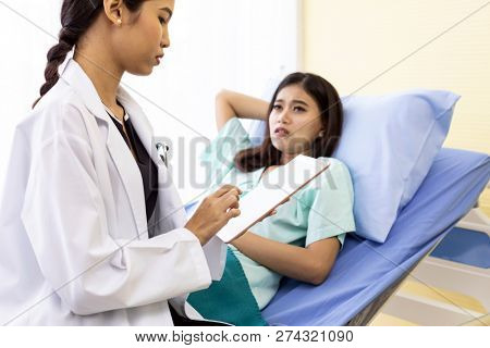 Patient fell worry when Asian Doctor make routine health check in hospital ward