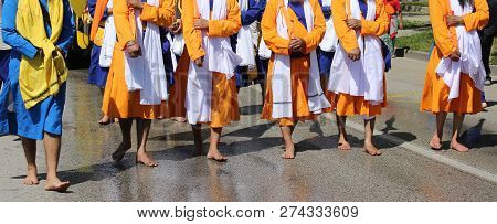 Religious Sikh Procession With The Barefoot Guards Through The Streets Of The City