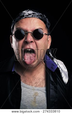 Rock star making facial expression and hand gesture