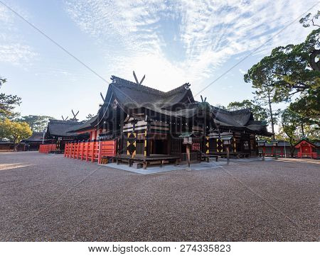 Wide Empty Gravel Expanse In Front Of Traditional Japanese Wooden Shrine