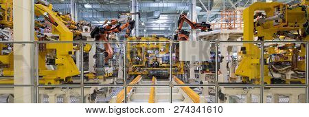 Automated Assembly Process Of Cars By Robots. Automotive Production Line. Long Format. Wide Frame