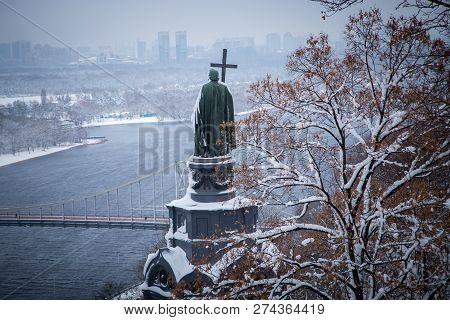 View Of The Monument To Vladimir The Holy Through Snow-covered Trees In Vladimirsky Park And View Of