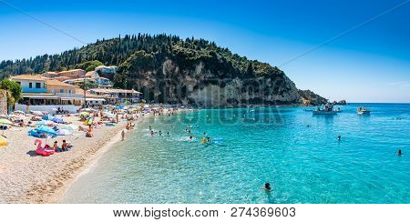 People In Summer Holiday On The Seaside Of Agios Nikitas Beach, In Lefkada Island Of Greece - Europe