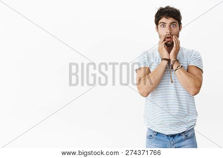 Portrait Of Shcoked Nervous And Stunned Young Masculine Male With Blue Eyes And Messy Hair Dropping 