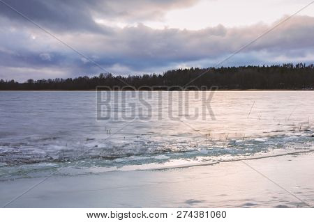 First Ice On The Lake In Late Autumn. Winter Coming Landscape