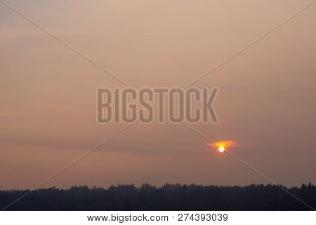 Hazy Skys Caused By Wildfires Make Sun Glow Gold