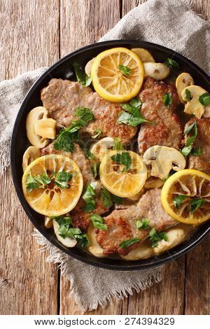 Italian Main Course Veal Scaloppini Cooked With Mushrooms And Lemons In A Spicy Sauce, Close-up. Ver
