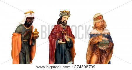 The three wise men. Ceramic figures isolated on white background