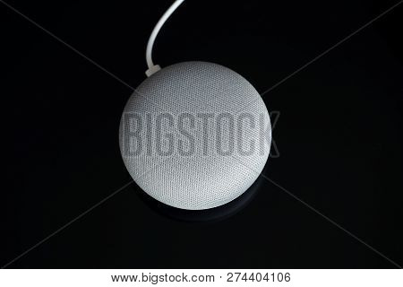 Paris, France - December 17 2018: Overhead View Of A Google Home Mini With Cable (chalk Color), Blac
