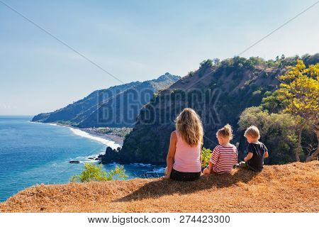 Family Vacation Lifestyle. Happy Mother, Kids On Hill With Scenic View Of High Cliffs, Fishers Villa
