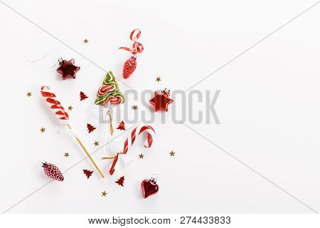Christmas Composition. Xmas Pink Decor, Christmas Candy Cane With Ribbon On White Background.