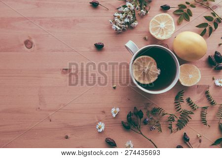 Rosehip Herbal Tea Flt Lay Top View With Slice Of Lemon On Wooden Table