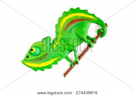 Chameleon From Plasticine On A White Background. Children's Crafts From Plasticine. Creativity From 