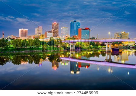 Little Rock, Arkansas, USA skyline on the Arkansas River at dusk. 