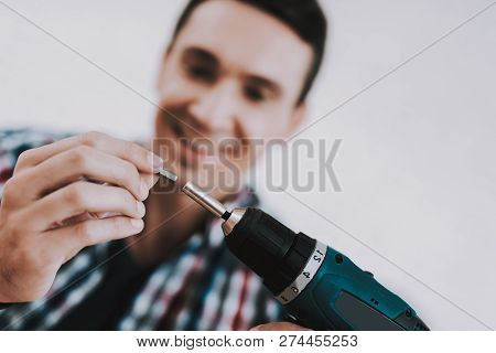 Young Man Assembling Wooden Bookshelf At Home. Wooden Bookcase. Selfmade Furniture. Man And Hobby. W