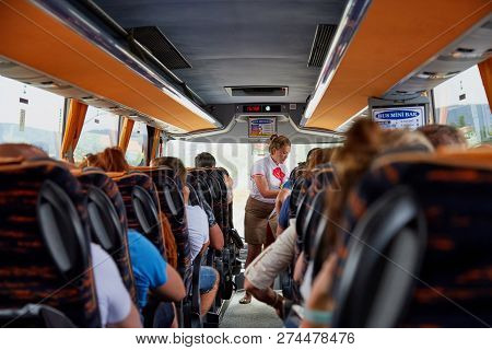 Marmaris, Turkey - May 26, 2018: Female Guide In The Bus With Tourists. People During Travel. Transf