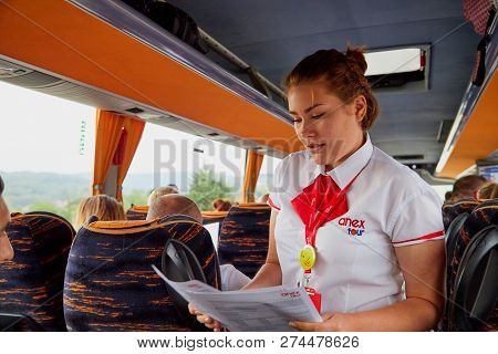Marmaris, Turkey - May 26, 2018: Female Guide In The Bus With Tourists. People During Travel. Transf