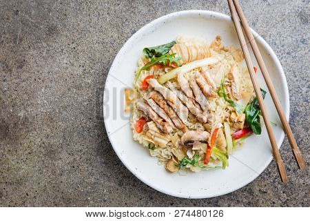 Japanese Ramen Noodle With Chicken, Shiitake Mushroms And Egg In White Bowl, Top View