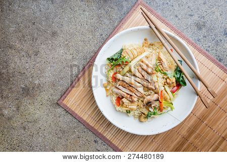 Japanese Ramen Noodle With Chicken, Shiitake Mushroms And Egg In White Bowl, Top View
