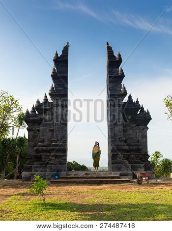 Girl Is Standing In The Gate Of Pura Lempuyang Temple On Bali Island, Indonesia