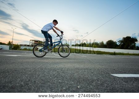 Fearless Boy Making Tricks On His Bike