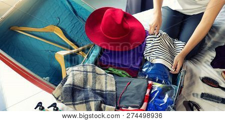 Girl Packing The Luggage Prepare For Her Trip