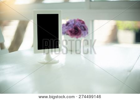 Little Black Board On The White Table