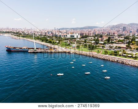Aerial Drone View Of Kartal Istanbul City Seaside With Garbage Scow Vessel Old Ship. City Life.