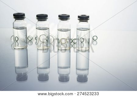 Group Of Vials With Medication On Blue Methacrylate Table. Horizontal Composition.