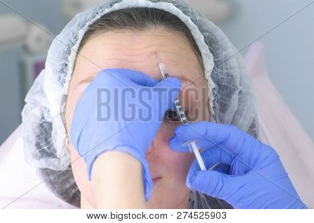 Contour Plastic Face. Rejuvenating Facial Injections Procedure For Tightening And Smoothing Wrinkles