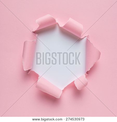 Vivid Pink Ripped Paper With Burst Hole Background. Minimal Abst