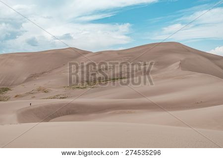 Hikers Hiking Star Dune, The Tallest Sand Dune In Great Sand Dunes National Park In Colorado, Usa
