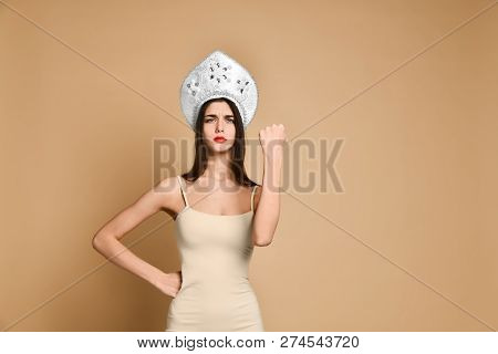 Cute Woman Shows Fist At Camera, Threatens You About Something, Has Displeased Sullen Facial Express