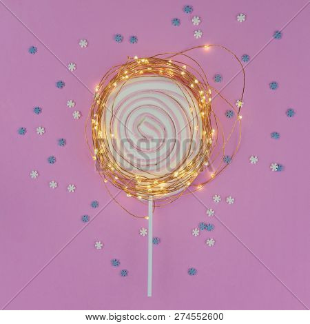 Christmas Abstract Composition With Round Marshmallow Lollipop On Stick And Christmas Fairylight On 