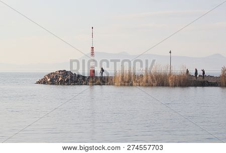 People On The Pier At The Lake Balaton In Winter