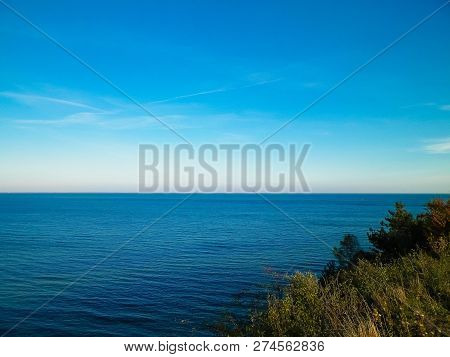 Baltic Sea From Cliff In Mechelinki, Poland. Nature And Travel Concept. Copy Space On Blue Sky.