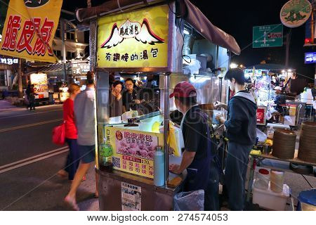 Kenting, Taiwan - November 28, 2018: People Walk By Xiaolongbao Steamed Bun Stall At Kenting Street 