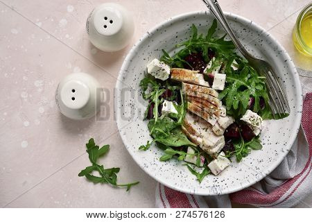 Beetroot Salad With Arugula, Grilled Chicken Fillet And Feta Cheese.top View With Copy Space.