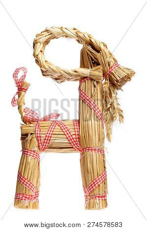 Side View Of A Traditional Straw Billy Goat Christmas Decoration Isolated On White.
