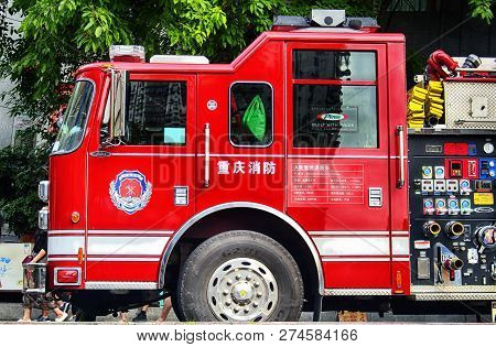 Chongqing, China.  June 23, 2018. A Red China Fire Services Truck Parked Outside Of Arhat Temple In 