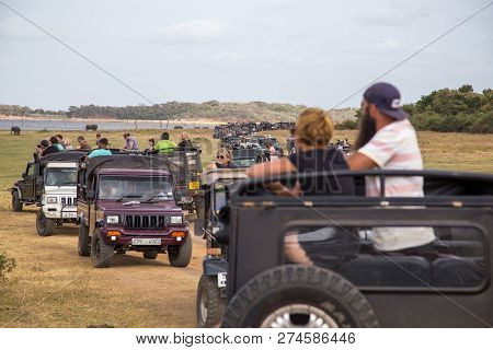 Kaudulla National Park, Sri Lanka - August 16, 2018: Big Row Of Jeeps With Tourists Inside Kaudulla 