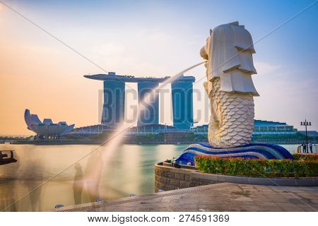 SINGAPORE - SEPTEMBER 3, 2015: The Merlion statue fountain and the Singapore skyline. The landmark statue is considered the personification of Singapore. 