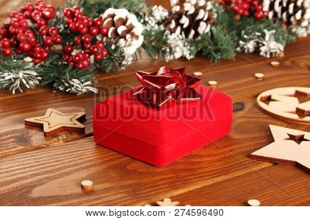 Spruce Branches, Cones And Red Berries On A White Wooden Background. Background For Christmas And Ne