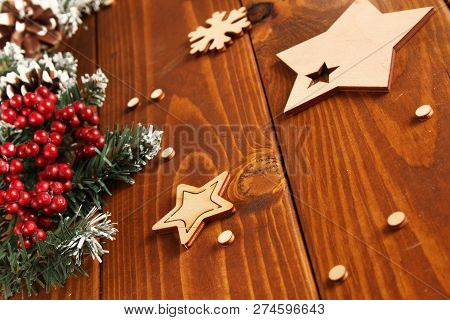 Spruce Branches, Cones And Red Berries On A White Wooden Background. Background For Christmas And Ne