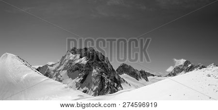 Black And White Panorama Of Snowy Mountains And Ski Slope For Freefiding. Caucasus Mountains, Region