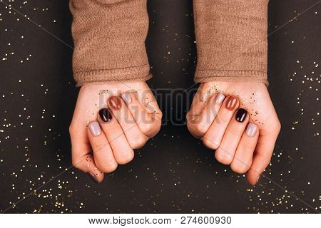Holiday Beautiful Manicure With Golden Decorations. Dark Tone.